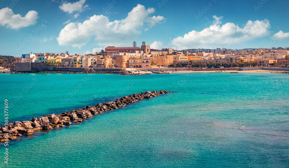 Spring morning view of coastal town in southern Italy’s Apulia region - Otranto, Italy, Europe. Bright sunny seascape of Mediterranean sea. Traveling concept background.