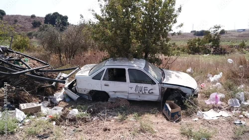 Abandoned rusty stolen cars in a junkyard. Scrap car. Abandoned rusty stolen cars in a junkyard. Scrap car.