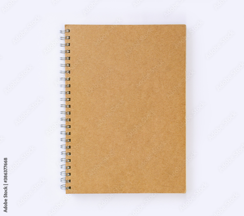 Blank recycled paper cover notebook top view on white desk background Blank recycled paper cover notebook top view on white desk background