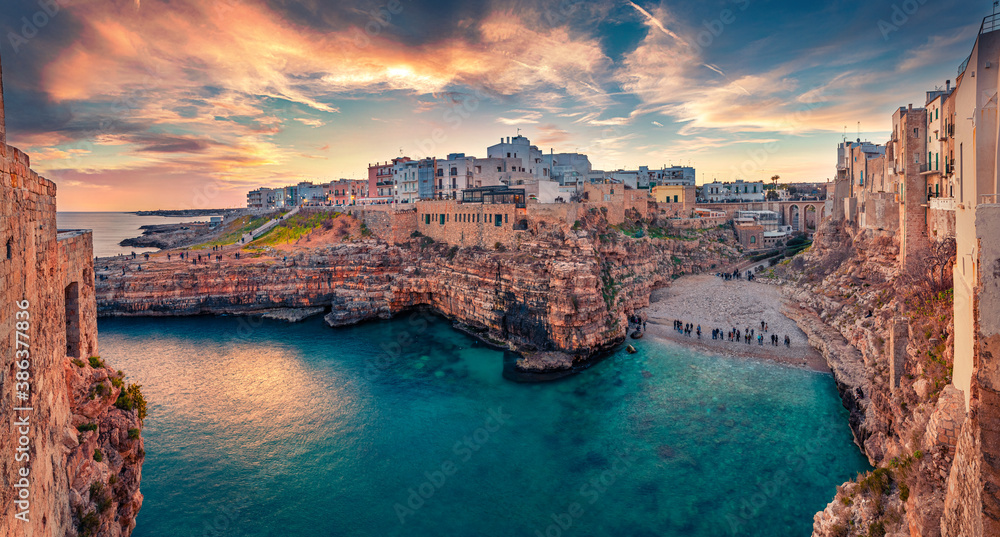 Spectacular spring cityscape of Polignano a Mare town, Puglia region, Italy, Europe. Incredible evening seascape of Adriatic sea. Traveling concept  background.