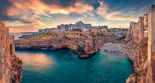 Spectacular spring cityscape of Polignano a Mare town, Puglia region, Italy, Europe. Incredible evening seascape of Adriatic sea. Traveling concept  background. photo