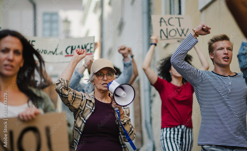 Fototapeta premium Group of people activists protesting on streets, strike and demonstration concept.