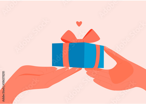 The hand gives a gift to the other hand. Gift and gift receipt. Love. Drunk a surprise. Charity