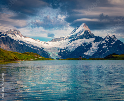 Schreckhorn mountain reflected in Bachalpsee lake. Unbelievable summer sunset on Swiss Bernese Alps, Switzerland, Europe. Beauty of nature concept background.