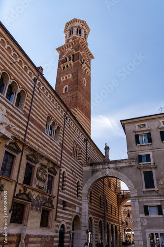 Wallpaper Mural "Torre dei Lamberti" clock tower of "Palazzo della Ragione" palace building in "Piazza Delle Erbe" square in Verona city historical centre, Courtyard Of The Old Market Torontodigital.ca