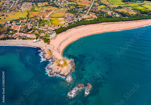 Top down view from flying drone.Colorful spring view of Torre di Bari tower. Superb morning scene of Sardinia island, Italy, Europe. Amazing seascape of Mediterranean sea.