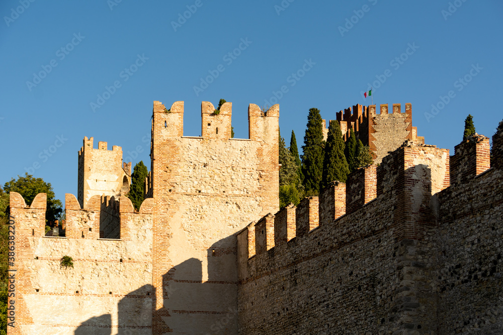 Medieval Castle of Soave in the province of Verona, Italy at sunset in autumn 