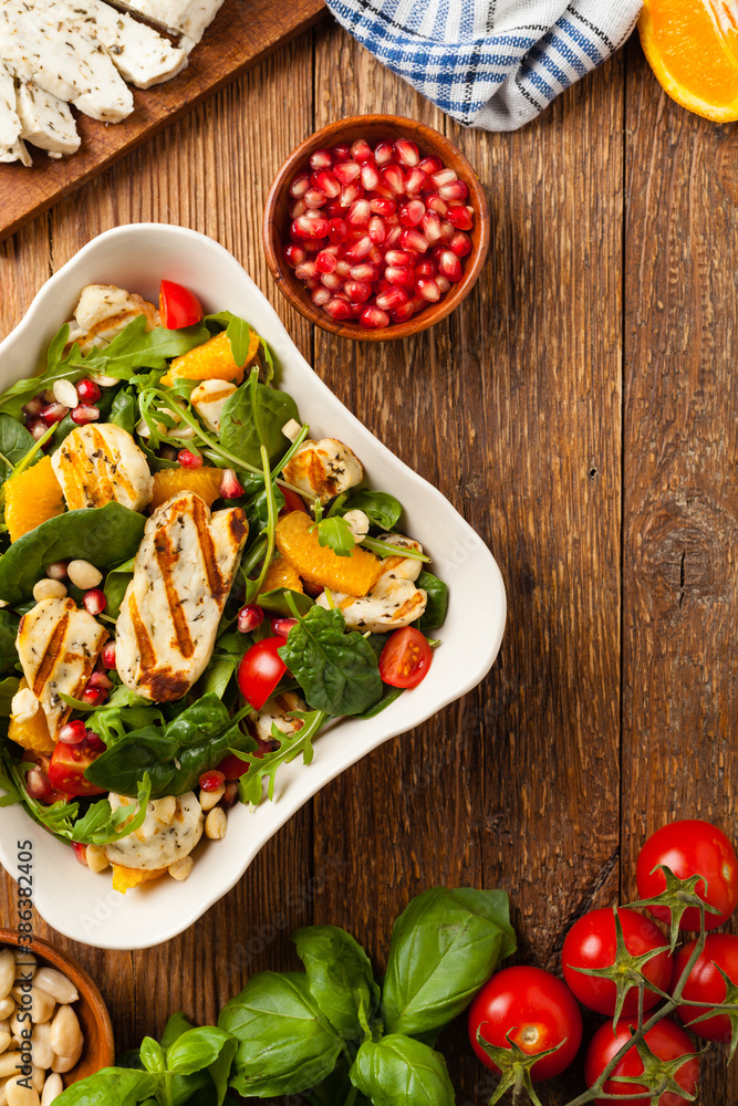 Traditional Greek salad with grilled Halloumi cheese with basil. Top view. Flat lay. Traditional Greek salad with grilled Halloumi cheese with basil. Top view. Flat lay.