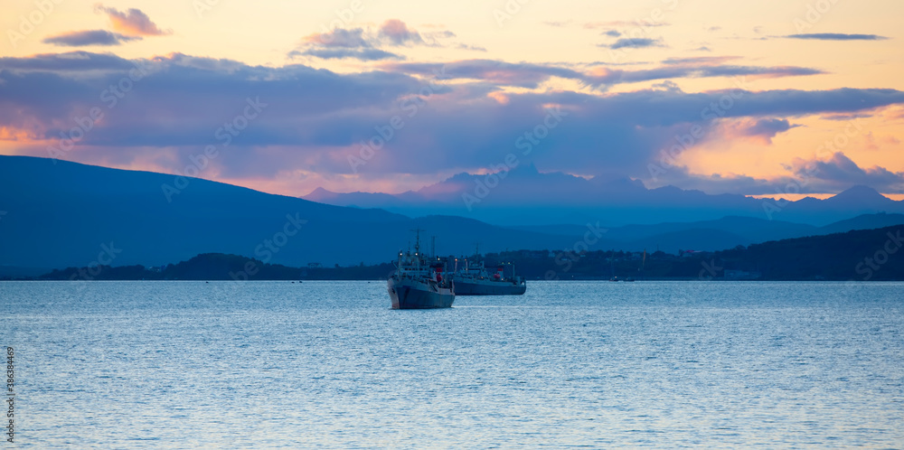  fishing ships at sunset in the Avacha Bay on the Kamchatka Peninsula