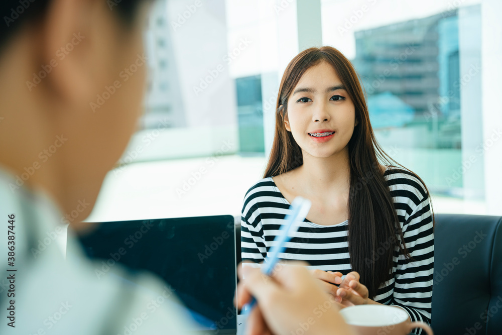 Fototapeta premium Journalist doing interview with beautiful influencer for blog writing.