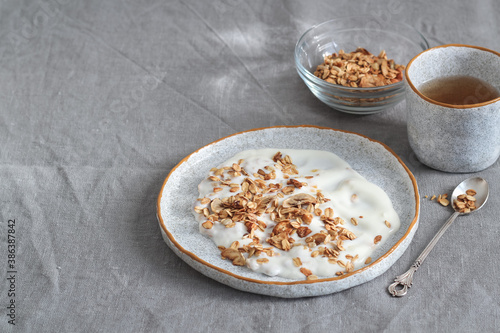 Breakfast table with homemade granola and yogurt