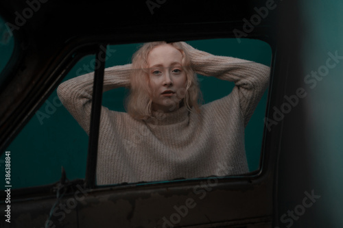 Portrait of a girl through a car window photo