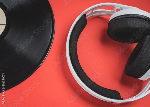 DJ composition of headphones and vinyl records on a bright background