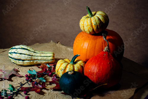 Bright pumpkins on the table on craft paper
