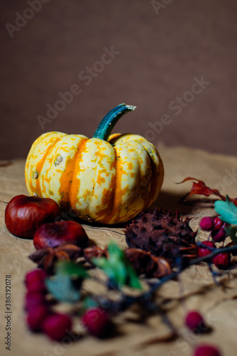 Bright pumpkins on the table on craft paper