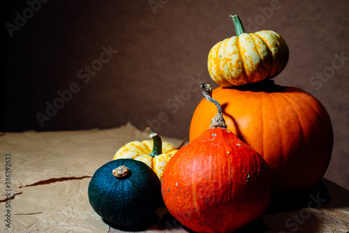 Bright pumpkins on the table on craft paper