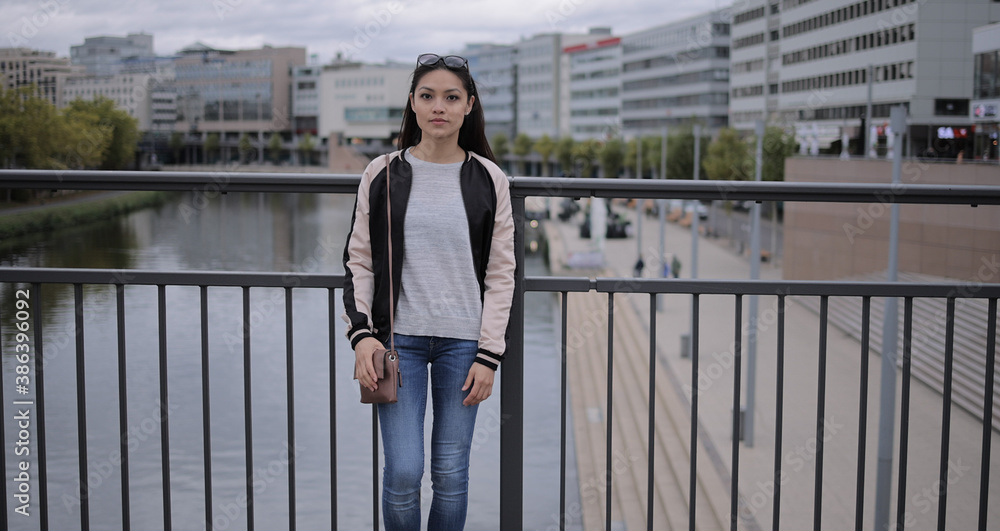 Young Asian woman in a city - people photography