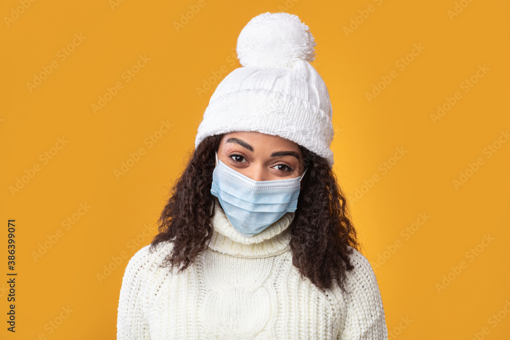 Portrait of a young black woman in medical mask Portrait of a young black woman in medical mask