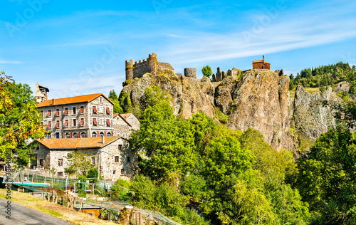 Arlempdes village with its castle on top of a basalt rock at the Loire river. Haute-Loire, France photo