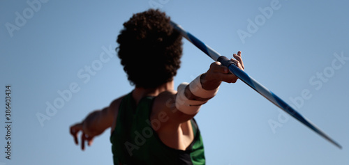 Schilderij op canvas Athlete about to throw a javelin in the stadium