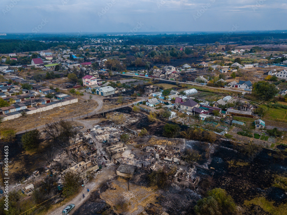 Destroyed houses after the fire in Ukraine. Aerial photo