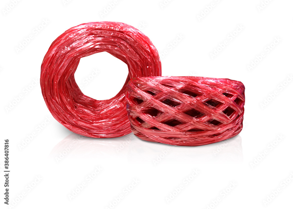 A roll of red plastic rope on a white background A roll of red plastic rope on a white background