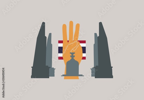 Concepts of three finger salute and democracy monument in Thailand