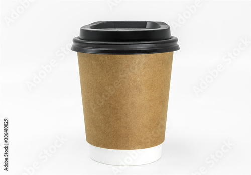Isolated coffee paper cup on white background, take out coffee paper cup, brown paper, black lid, close up front view, blank space for branding and design. Short and fat shape.