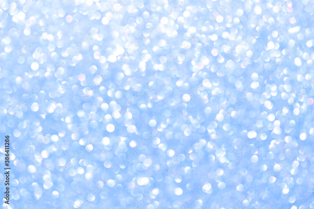 An abstract blue background with sparkle lights and bokeh. An abstract blue background with sparkle lights and bokeh.