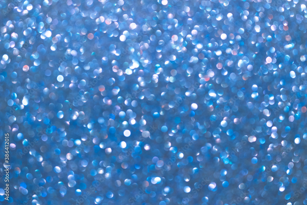 An abstract blue background with sparkle lights and bokeh. An abstract blue background with sparkle lights and bokeh.