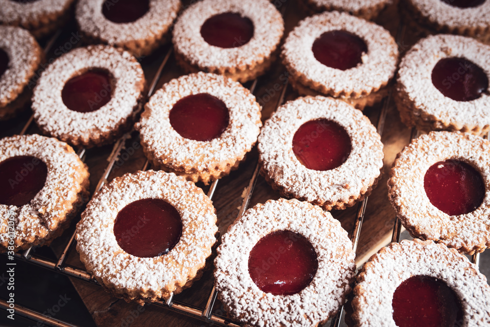 Homemade traditional linzer cookies
Homemade traditional linzer christmas cookies with strawberry jam.  Background with short depth of field for baking concepts with space for text.