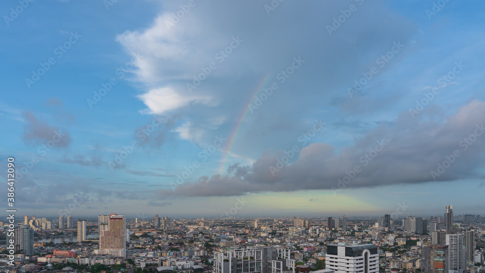 Obraz premium Aerial view of Bangkok Thailand skyline, on blue sky. There are clouds and rainbows, with copy space.