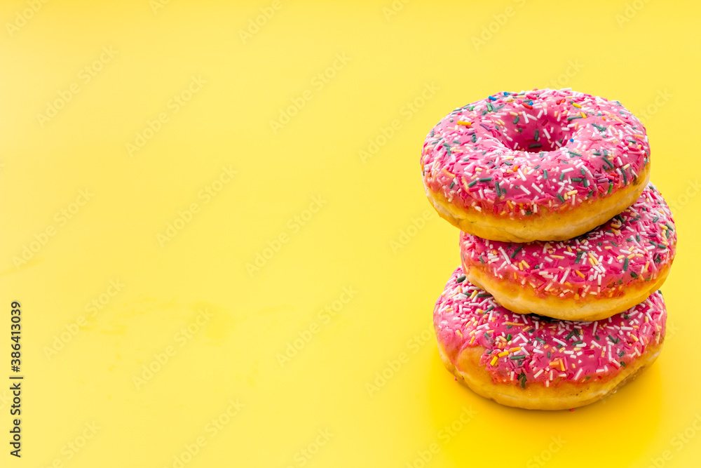 Pink berry donuts close up. Glazed and sprinkles bakery Pink berry donuts close up. Glazed and sprinkles bakery
