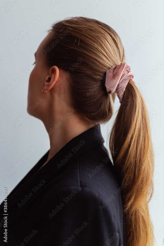 Close-up of a baby pink scrunchie, natural blonde young woman, Close-up of a baby pink scrunchie, natural blonde young woman,