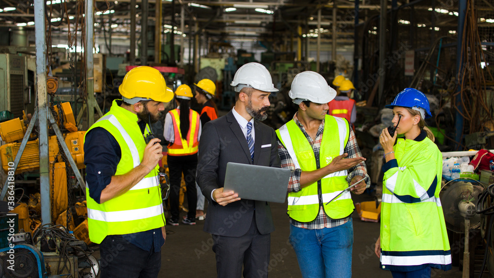 Workers talking in the factory. Workers talking in the factory.