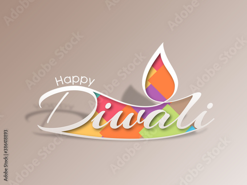 Happy Diwali greeting card with intricate calligraphy and illuminated Diwali lamp.