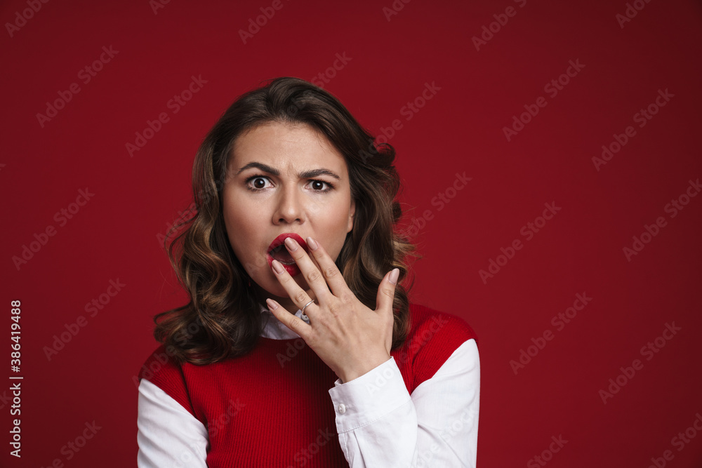 Beautiful shocked girl expressing surprise and covering her mouth Beautiful shocked girl expressing surprise and covering her mouth
