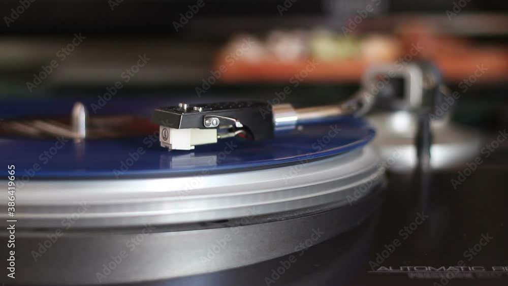 old blue vinyl record with clipping path. DJ Turntable with Vinyl Record, Playing, Top View. Close up at the needle on turntable old blue vinyl record with clipping path. DJ Turntable with Vinyl Record, Playing, Top View. Close up at the needle on turntable