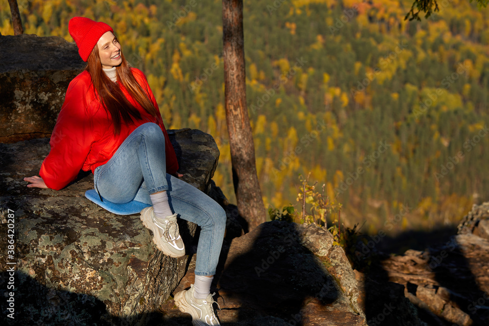 portrait of young good-looking fit redhead woman is travelling on mountains, vision, hiker looking mountain and enjoying nature around portrait of young good-looking fit redhead woman is travelling on mountains, vision, hiker looking mountain and enjoying nature around