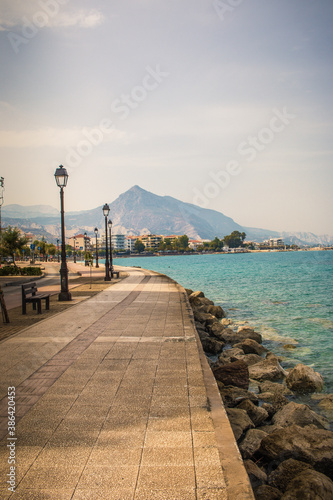 Central street in Xylokastro City with view of the big mountain