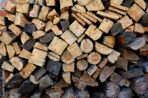 Wooden logs,boards, firewood. Harvesting firewood for the winter. Lumber for furniture making. Texture of wooden materials