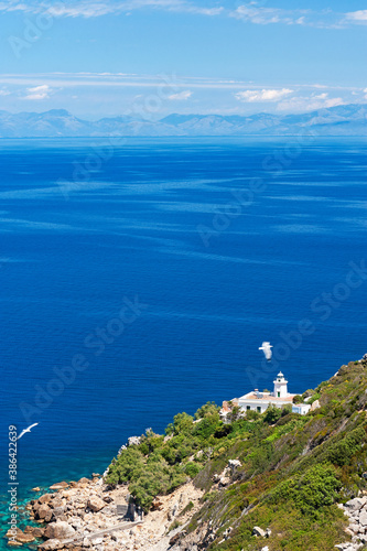 Zannone, Isole Ponziane, Latina district, Latium, Lazio, Italy, Europe,  National Park of Circeo, Italy, Europe, View of Capo Negro with the lighthouse, in the background the Lazio coast photo