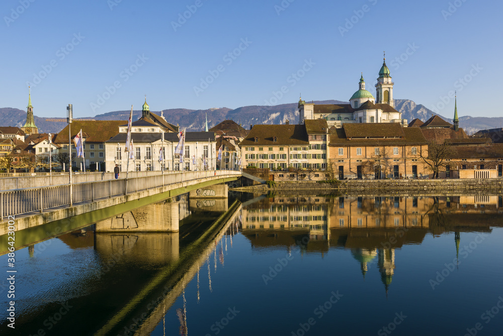 Riverside of Aare and houses dominated by Saint Ursus Cathedral in Solothurn, Switzerland