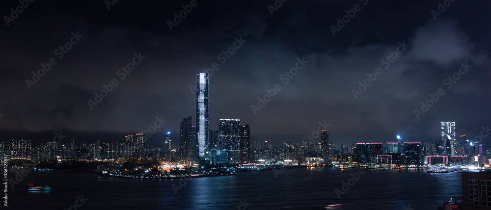 Hongkong city skyline at night with cloudy weather.
