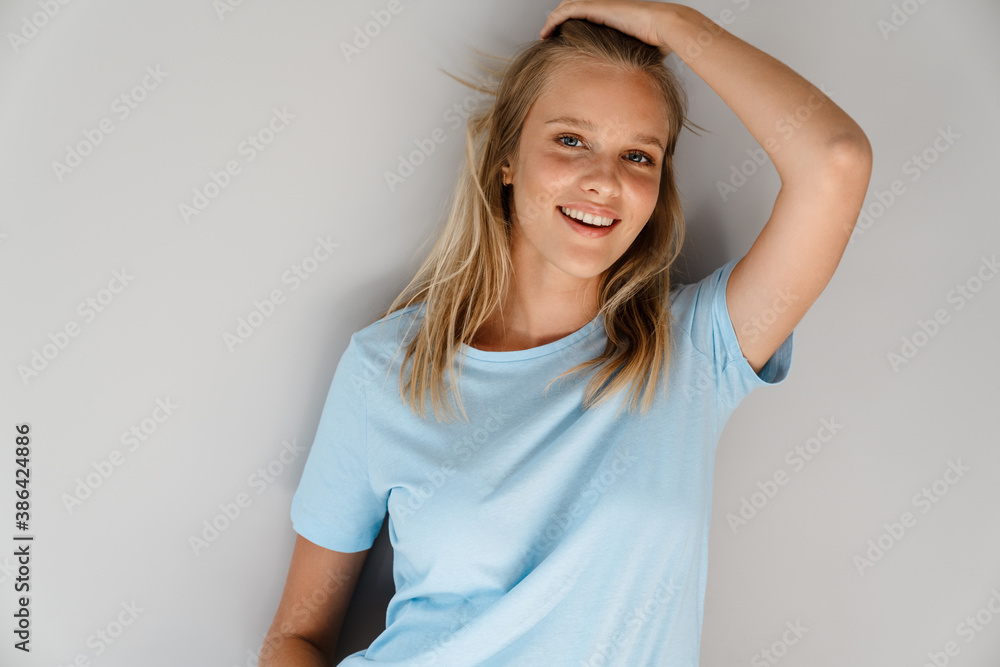 Beautiful joyful caucasian girl posing and smiling at camera Beautiful joyful caucasian girl posing and smiling at camera