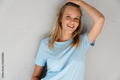 Beautiful joyful caucasian girl posing and smiling at camera