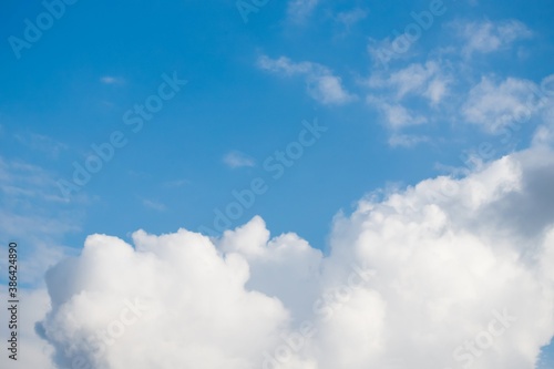 Beautiful white fluffy big clouds on a blue sky background