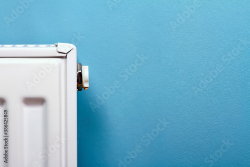 Close up of a central heating radiator and bleed valve