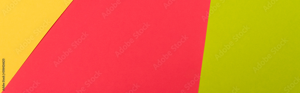 top view of colorful abstract yellow, red, green paper background, panoramic shot top view of colorful abstract yellow, red, green paper background, panoramic shot
