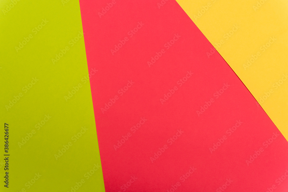 top view of colorful abstract yellow, red, green paper background top view of colorful abstract yellow, red, green paper background